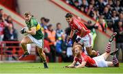 6 July 2014; James O'Donoghue, Kerry, races clear of  Cork defenders Michael Shields and Tomas Clancy. Munster GAA Football Senior Championship Final, Cork v Kerry, Páirc Ui Chaoimh, Cork. Picture credit: Brendan Moran / SPORTSFILE