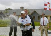 24 July 2006; Two time Major winner John Daly sprays the champagne, in the company of Minister for Arts, Sport and Tourism, John O'Donoghue, TD, and David O'Sullivan, right, Director of Golf, Blarney Golf Resort, at the opening of the Blarney Golf Resort, Blarney, Co. Cork. The 50 million euro complex on a magnificent 164 acre site, has as it's centrepiece, a John Daly designed championship course and also comprises a 62 bedroom Ramada Hotel, 56 luxury self catering suites and the Sentosa Spa. This is the first course in Europe to be designed by John Daly. Picture credit: Brendan Moran / SPORTSFILE