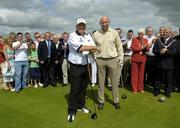 24 July 2006; Two time Major winner John Daly with Cork hurler Brian Corcoran at the opening of the Blarney Golf Resort, Blarney, Co. Cork. The 50 million euro complex on a magnificent 164 acre site, has as it's centrepiece, a John Daly designed championship course and also comprises a 62 bedroom Ramada Hotel, 56 luxury self catering suites and the Sentosa Spa. This is the first course in Europe to be designed by John Daly. Picture credit: Brendan Moran / SPORTSFILE