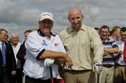 24 July 2006; Two time Major winner John Daly with Cork hurler Brian Corcoran at the opening of the Blarney Golf Resort, Blarney, Co. Cork. The 50 million euro complex on a magnificent 164 acre site, has as it's centrepiece, a John Daly designed championship course and also comprises a 62 bedroom Ramada Hotel, 56 luxury self catering suites and the Sentosa Spa. This is the first course in Europe to be designed by John Daly. Picture credit: Brendan Moran / SPORTSFILE