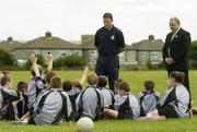 27 July 2006; The Vhi Cul Camps, the official GAA summer camps, got off to a flying start all around the country at the start of July and are now in full swing with up to 75,000 children expected to attend the camps nationwide between July 3rd and 25th August. At the Parnells GAA camp in Coolock, Dublin are, GAA President Nickey Brennan and Dublin footballer and Vhi Cul Camp ambassador Conal Keaney answering questions from children from the Coolock / Artane area. Chanel School, Coolock, Dublin. Picture credit; Brendan Moran / SPORTSFILE