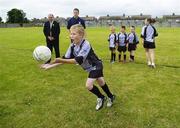 27 July 2006; The Vhi Cul Camps, the official GAA summer camps, got off to a flying start all around the country at the start of July and are now in full swing with up to 75,000 children expected to attend the camps nationwide between July 3rd and 25th August. Pictured at the Parnells GAA camp in Coolock, Dublin, are GAA President Nickey Brennan with Dublin footballer and Vhi Cul Camp ambassador Conal Keaney watching Stephen Canning, age 8, complete a hand pass drill. Chanel School, Coolock, Dublin. Picture credit; Brendan Moran / SPORTSFILE