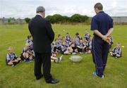 27 July 2006; The Vhi Cul Camps, the official GAA summer camps, got off to a flying start all around the country at the start of July and are now in full swing with up to 75,000 children expected to attend the camps nationwide between July 3rd and 25th August. Pictured at the Parnells GAA camp in Coolock, Dublin, are GAA President Nickey Brennan with Dublin footballer and Vhi Cul Camp ambassador Conal Keaney speaking with children from the Coolock / Artane area. Chanel School, Coolock, Dublin. Picture credit; Brendan Moran / SPORTSFILE