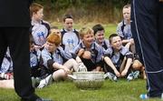 27 July 2006; The Vhi Cul Camps, the official GAA summer camps, got off to a flying start all around the country at the start of July and are now in full swing with up to 75,000 children expected to attend the camps nationwide between July 3rd and 25th August. Pictured at the Parnells GAA camp in Coolock, Dublin, are children from the Coolock / Artane area listening to GAA President Nickey Brennan with Dublin footballer and Vhi Cul Camp ambassador Conal Keaney. Chanel School, Coolock, Dublin. Picture credit; Brendan Moran / SPORTSFILE