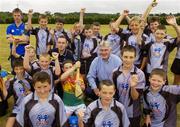 28 July 2006; The Vhi Cul Camps, the official GAA summer camps, got off to a flying start all around the country at the start of July and are now in full swing with up to 75,000 children expected to attend the camps nationwide between July 3rd and 25th August. Pictured at the camp in Bagenalstown, Co. Carlow, are, Tipperary hurler and Vhi Cul Camp ambassador Eoin Kelly and Tony McSweeney, Director of Corporate Business, VHI Healthcare. Bagenalstown, Co. Carlow. Picture credit; Matt Browne / SPORTSFILE