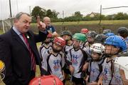 28 July 2006; The Vhi Cul Camps, the official GAA summer camps, got off to a flying start all around the country at the start of July and are now in full swing with up to 75,000 children expected to attend the camps nationwide between July 3rd and 25th August. Pictured at the camp in Bagenalstown, Co. Carlow, are, GAA President Nickey Brennan and some of the kids woh a attended the camp. Bagenalstown, Co. Carlow. Picture credit; Matt Browne / SPORTSFILE