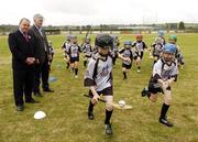 28 July 2006; The Vhi Cul Camps, the official GAA summer camps, got off to a flying start all around the country at the start of July and are now in full swing with up to 75,000 children expected to attend the camps nationwide between July 3rd and 25th August. Pictured at the camp in Bagenalstown, Co. Carlow, are, GAA President Nickey Brennan with Tony McSweeney, Director of Corporate Business, VHI Healthcare, in action are Mark Kennedy, age 10 from Bagenalstown, and Aoibheann Byrne, age 8, Bagenalstown, Co. Carlow. Picture credit; Matt Browne / SPORTSFILE
