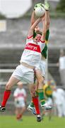 30 July 2006; David Moran, Kerry, in action against Thady Gavin, Mayo. ESB All-Ireland Minor Football Championship Quarter-Final, Kerry v Mayo, Cusack Park, Ennis, Co. Clare. Picture credit; Kieran Clancy / SPORTSFILE