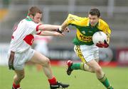 30 July 2006; Jamie Dolan, Kerry, in action against Liam Tunney, Mayo. ESB All-Ireland Minor Football Championship Quarter-Final, Kerry v Mayo, Cusack Park, Ennis, Co. Clare. Picture credit; Kieran Clancy / SPORTSFILE