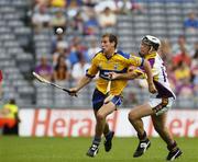 23 July 2006; Brian O'Connell, Clare, in action against Michael Doyle, Wexford. Guinness All-Ireland Senior Hurling Championship Quarter-Final, Clare v Wexford, Croke Park, Dublin. Picture credit: Ray McManus / SPORTSFILE