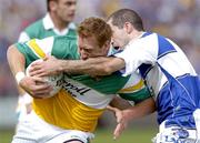 30 July 2006; Neville Coughlan, Offaly, in action against Aidan Fennelly, Laois. Bank of Ireland All-Ireland Senior Football Championship Qualifier, Round 4, Laois v Offaly, O'Moore Park, Portlaoise, Co. Laois. Picture credit; Damien Eagers / SPORTSFILE