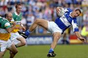 30 July 2006; Darren Rooney, Laois, in action against Mark Daly, Offaly. Bank of Ireland All-Ireland Senior Football Championship Qualifier, Round 4, Laois v Offaly, O'Moore Park, Portlaoise, Co. Laois. Picture credit; Damien Eagers / SPORTSFILE