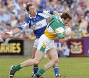 30 July 2006; Ciaran McManus, Offaly, in action against Chris Conway, Laois. Bank of Ireland All-Ireland Senior Football Championship Qualifier, Round 4, Laois v Offaly, O'Moore Park, Portlaoise, Co. Laois. Picture credit; Damien Eagers / SPORTSFILE