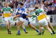 30 July 2006; Brendan Quigley, Laois, in action against Shane Sullivan, (6), and Paul McConway, Offaly. Bank of Ireland All-Ireland Senior Football Championship Qualifier, Round 4, Laois v Offaly, O'Moore Park, Portlaoise, Co. Laois. Picture credit; Brian Lawless / SPORTSFILE