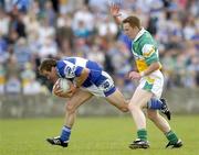 30 July 2006; Chris Conway, Laois, in action against Pascal Kelleghan, Offaly. Bank of Ireland All-Ireland Senior Football Championship Qualifier, Round 4, Laois v Offaly, O'Moore Park, Portlaoise, Co. Laois. Picture credit; Brian Lawless / SPORTSFILE