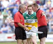 30 July 2006; Referee Joe McQuillan, right, consults with linesman Sean O'Se over a lineball decision as Offaly's Pascal Kellaghan appeals the decision. Bank of Ireland All-Ireland Senior Football Championship Qualifier, Round 4, Laois v Offaly, O'Moore Park, Portlaoise, Co. Laois. Picture credit; Damien Eagers / SPORTSFILE