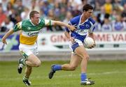 30 July 2006; Brendan Quigley, Laois, in action against Shane Sullivan, Offaly. Bank of Ireland All-Ireland Senior Football Championship Qualifier, Round 4, Laois v Offaly, O'Moore Park, Portlaoise, Co. Laois. Picture credit; Brian Lawless / SPORTSFILE