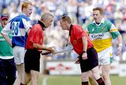 30 July 2006; Refeere Joe McQuillan, right, consults with linesman Sean O'Se over a lineball decision as Offaly's Pascal Kellaghan and Laois's Padraig Clancy look on. Bank of Ireland All-Ireland Senior Football Championship Qualifier, Round 4, Laois v Offaly, O'Moore Park, Portlaoise, Co. Laois. Picture credit; Damien Eagers / SPORTSFILE