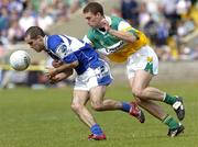 30 July 2006; Aidan Fennelly, Laois, in action against Niall McNamee, Offaly. Bank of Ireland All-Ireland Senior Football Championship Qualifier, Round 4, Laois v Offaly, O'Moore Park, Portlaoise, Co. Laois. Picture credit; Damien Eagers / SPORTSFILE