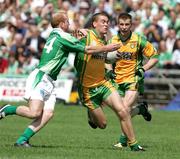 30 July 2006; Shane Doherty, Fermanagh, in action against Eamon McGee, Donegal. Bank of Ireland All-Ireland Senior Football Championship Qualifier, Round 4, Fermanagh v Donegal, Brewster Park, Enniskillen, Co. Fermanagh. Picture credit; Oliver McVeigh / SPORTSFILE