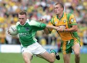30 July 2006; Martin McGrath, Fermanagh, in action against Eamon McGee, Donegal. Bank of Ireland All-Ireland Senior Football Championship Qualifier, Round 4, Fermanagh v Donegal, Brewster Park, Enniskillen, Co. Fermanagh. Picture credit; Oliver McVeigh / SPORTSFILE