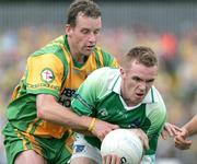 30 July 2006; Martin McGrath, Fermanagh, in action against Barry Monaghan, Donegal. Bank of Ireland All-Ireland Senior Football Championship Qualifier, Round 4, Fermanagh v Donegal, Brewster Park, Enniskillen, Co. Fermanagh. Picture credit; Oliver McVeigh / SPORTSFILE