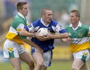 30 July 2006; Billy Sheehan, Laois, in action against Karol Slattery, Offaly. Bank of Ireland All-Ireland Senior Football Championship Qualifier, Round 4, Laois v Offaly, O'Moore Park, Portlaoise, Co. Laois. Picture credit; Brian Lawless / SPORTSFILE