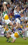 30 July 2006; Ciaran McManus, left, and Mark Daly, Offaly, in action against Billy Sheehan, Laois. Bank of Ireland All-Ireland Senior Football Championship Qualifier, Round 4, Laois v Offaly, O'Moore Park, Portlaoise, Co. Laois. Picture credit; Brian Lawless / SPORTSFILE