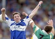 30 July 2006; Ian Fitzgerald, Laois, in action against Ger Rafferty, Offaly. Bank of Ireland All-Ireland Senior Football Championship Qualifier, Round 4, Laois v Offaly, O'Moore Park, Portlaoise, Co. Laois. Picture credit; Brian Lawless / SPORTSFILE