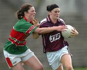 30 July 2006; Geraldine Conneely, Galway, in action against Helena Lohan, Mayo. TG4 Ladies Connacht Senior Football Final, Mayo v Galway, McHale Park, Castlebar, Co. Mayo. Picture credit; Ray Ryan / SPORTSFILE