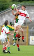 30 July 2006; Tom Parsons, Mayo, in action against David Moran, Kerry. ESB All-Ireland Minor Football Championship Quarter-Final, Kerry v Mayo, Cusack Park, Ennis, Co. Clare. Picture credit; Kieran Clancy / SPORTSFILE
