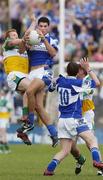30 July 2006; Brendan Quigley, Laois, contests a high ball with Neville Coughlan, Offaly. Bank of Ireland All-Ireland Senior Football Championship Qualifier, Round 4, Laois v Offaly, O'Moore Park, Portlaoise, Co. Laois. Picture credit; Damien Eagers / SPORTSFILE