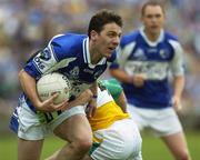 30 July 2006; Ian Fitzgerald, Laois, in action against Nigel Grennan, Offaly. Bank of Ireland All-Ireland Senior Football Championship Qualifier, Round 4, Laois v Offaly, O'Moore Park, Portlaoise, Co. Laois. Picture credit; Damien Eagers / SPORTSFILE