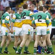 30 July 2006; Billy Sheehan, Laois, reacts to Offaly players during the match. Bank of Ireland All-Ireland Senior Football Championship Qualifier, Round 4, Laois v Offaly, O'Moore Park, Portlaoise, Co. Laois. Picture credit; Brian Lawless / SPORTSFILE