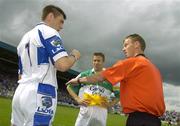 30 July 2006; Laois goalkeeper and captain Fergal Byron, left, chooses which way his team will play after winning the coin toss as referee Joe McQuillan and Offaly captain Karol Slattery look on. Bank of Ireland All-Ireland Senior Football Championship Qualifier, Round 4, Laois v Offaly, O'Moore Park, Portlaoise, Co. Laois. Picture credit; Brian Lawless / SPORTSFILE