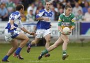 30 July 2006; Niall McNamee, Offaly, in action against Tom Kelly, Laois. Bank of Ireland All-Ireland Senior Football Championship Qualifier, Round 4, Laois v Offaly, O'Moore Park, Portlaoise, Co. Laois. Picture credit; Brian Lawless / SPORTSFILE