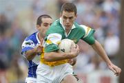30 July 2006; Niall McNamee, Offaly, in action against Aidan Fennelly, Laois. Bank of Ireland All-Ireland Senior Football Championship Qualifier, Round 4, Laois v Offaly, O'Moore Park, Portlaoise, Co. Laois. Picture credit; Brian Lawless / SPORTSFILE