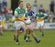 30 July 2006; Pascal Kellaghan, Offaly, in action against Tom Kelly, Laois. Bank of Ireland All-Ireland Senior Football Championship Qualifier, Round 4, Laois v Offaly, O'Moore Park, Portlaoise, Co. Laois. Picture credit; Brian Lawless / SPORTSFILE