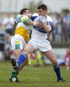 30 July 2006; Fergal Byron, Laois, in action against Thomas Deehan, Offaly. Bank of Ireland All-Ireland Senior Football Championship Qualifier, Round 4, Laois v Offaly, O'Moore Park, Portlaoise, Co. Laois. Picture credit; Brian Lawless / SPORTSFILE