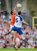 6 July 2014; Kevin Dyas, Armagh, in action against Vinny Corey, Monaghan. Ulster GAA Football Senior Championship, Semi-Final Replay, Armagh v Monaghan, St Tiernach's Park, Clones, Co. Monaghan. Picture credit: Piaras Ó Mídheach / SPORTSFILE