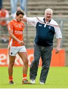 6 July 2014; Armagh manager Paul Grimley consoles Stefan Campbell as he leaves the field after being sent off for a black card offence. Ulster GAA Football Senior Championship, Semi-Final Replay, Armagh v Monaghan, St Tiernach's Park, Clones, Co. Monaghan. Picture credit: Piaras Ó Mídheach / SPORTSFILE