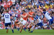 6 July 2014; Mark Shields, Armagh, in action against Paudie McKenna, left, Dermot Malone, centre, and Darren Hughes , Monaghan. Ulster GAA Football Senior Championship, Semi-Final Replay, Armagh v Monaghan, St Tiernach's Park, Clones, Co. Monaghan. Picture credit: Ramsey Cardy / SPORTSFILE