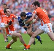 6 July 2014; Ryan Wylie, Monaghan, in action against Tony Kernan, left, and Aaron Findon, Armagh. Ulster GAA Football Senior Championship, Semi-Final Replay, Armagh v Monaghan, St Tiernach's Park, Clones, Co. Monaghan. Picture credit: Ramsey Cardy / SPORTSFILE