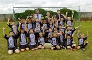 27 July 2006; The Vhi Cul Camps, the official GAA summer camps, got off to a flying start all around the country at the start of July and are now in full swing with up to 75,000 children expected to attend the camps nationwide between July 3rd and 25th August. Pictured at the Parnells GAA camp in Coolock, Dublin are, from left, Vincent Sheridan, CEO, Vhi Healthcare, GAA President Nickey Brennan with Dublin footballer and Vhi Cul Camp ambassador Conal Keaney. Chanel School, Coolock, Dublin. Picture credit; Brendan Moran / SPORTSFILE