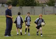 27 July 2006; The Vhi Cul Camps, the official GAA summer camps, got off to a flying start all around the country at the start of July and are now in full swing with up to 75,000 children expected to attend the camps nationwide between July 3rd and 25th August. Pictured at the Parnells GAA camp in Coolock, Dublin is Dublin footballer and Vhi Cul Camp ambassador Conal Keaney. Chanel School, Coolock, Dublin. Picture credit; Brendan Moran / SPORTSFILE
