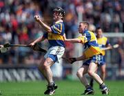 6 June 1999; Brian O'Dwyer of Tipperary in action against Seanie Barry of Clare during the Munster Intermediate Hurling Championship match between Tipperary and Clare at Páirc Uí Chaoimh in Cork. Photo by Ray McManus/Sportsfile
