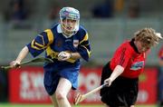 7 August 1999; Deirdre Hughes of Tipperary is tackled by Pauline Greenduring of Down during the All Ireland senior camogie championship semi-final match between Down and Tipperary at Parnell Park in Dublin. Photo by Ray McManus/Sportsfile