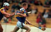 8 August 1999; Dermot Gleeson of Tipperary in action against David O'Connor of Wexford during the All-Ireland Minor Hurling Championship Semi-Final match between  Tipperary and Wexford at Croke Park in Dublin. Photo by Brendan Moran/Sportsfile