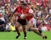1 August 1999; Diarmuid Marsden of Armagh in action against Finbar Caufield of Down during the Bank of Ireland Ulster Senior Football Championship Final match between Armagh and Down at St Tiernach's Park at Clones in Monaghan. Photo by David Maher/Sportsfile