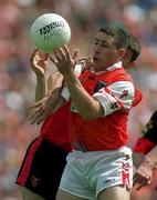 1 August 1999; Diarmuid Marsden of Armagh in action against Finbar Caufield of Down during the Bank of Ireland Ulster Senior Football Championship Final match between Armagh and Down at St Tiernach's Park at Clones in Monaghan. Photo by David Maher/Sportsfile